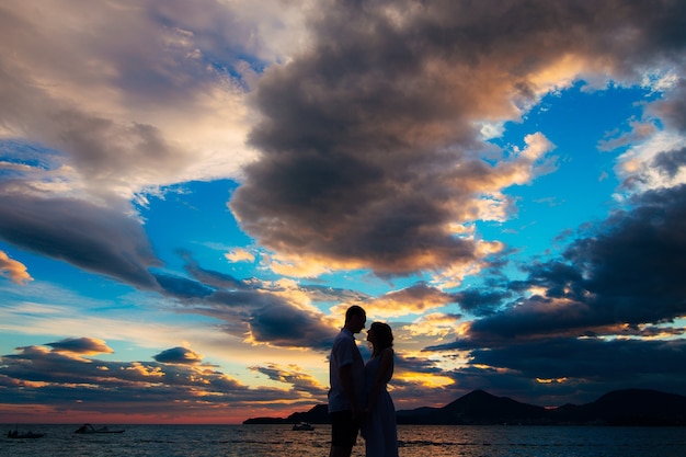 Silhouettes of couples near sveti stefan