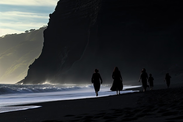 Silhouettes of people walking along the beach at sunset Iceland Silhouettes of tourists enjoying the black sand beach and ocean waves AI Generated