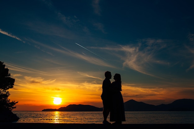 Silhouettes at sunset on the beach