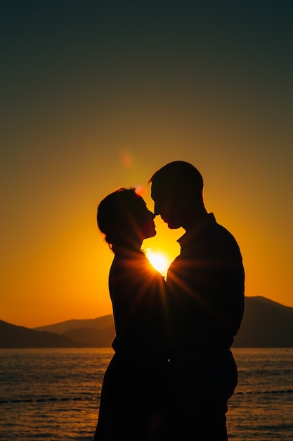 Silhouettes at sunset on the beach