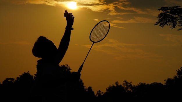 Silhouettes winner indian man playing badminton