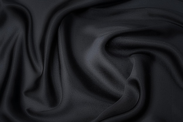 Silk or cotton fabric tissue Dark gray or black color Texture background pattern