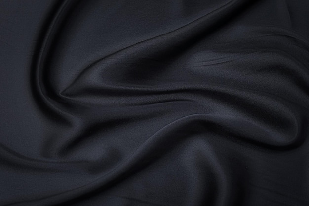 Silk or cotton fabric tissue Dark gray or black color Texture background pattern