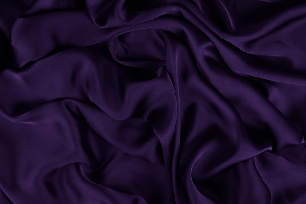 Silk or satin luxury fabric texture can use as abstract background. Top view.