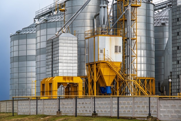 Silos and agroprocessing plant for processing for drying cleaning and storage and seed preparation complex