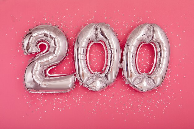 Silver balloon showing number  on pink background