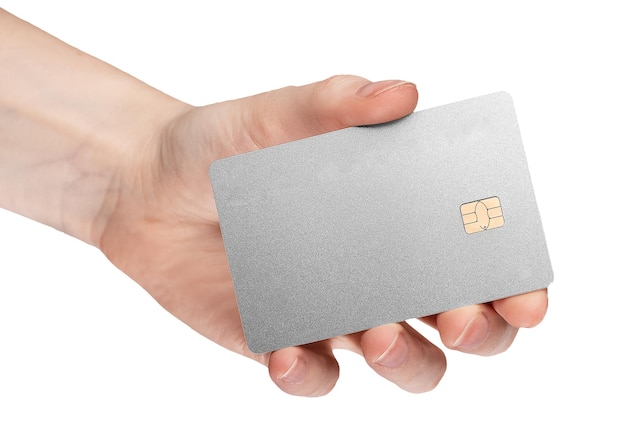 Silver bank card with chip in female hand isolated on white background