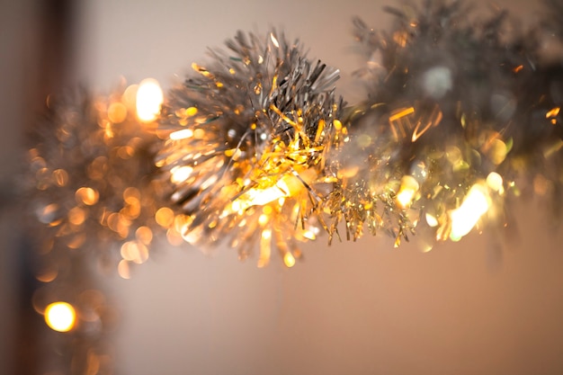 silver christmas garland with lights background