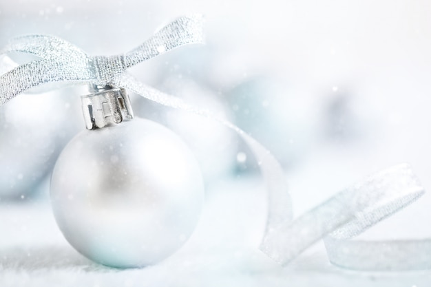 Silver Christmas toys on a light background.