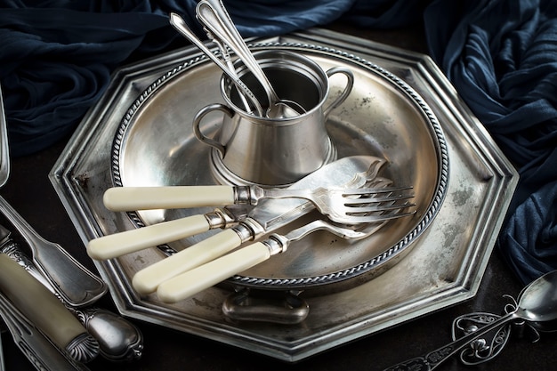 Silver dishes on old surface