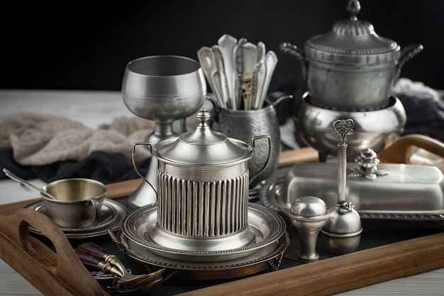 Silver dishes on old surface