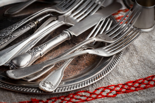 Silver dishes on old table