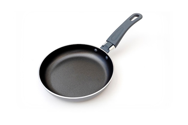 Silver frying pan with teflon nonstick surface isolated on white