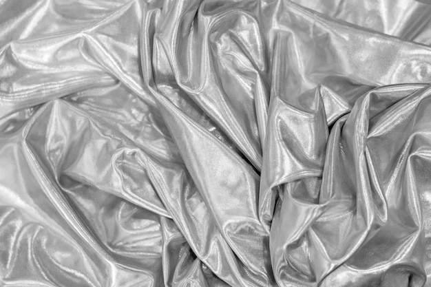 Silver gray silk fabric textile texture background.