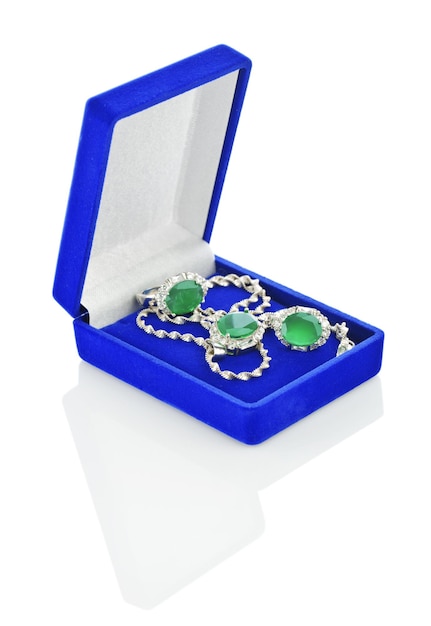 Silver jewelry in darkblue box isolated