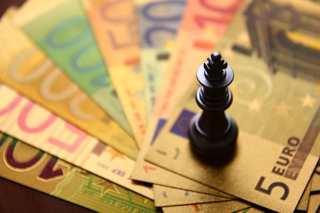 Silver king chess on euro banknote strategy money concept