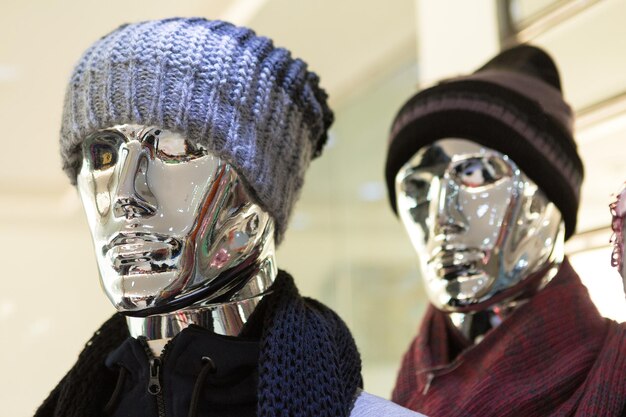 Silver mannequins in a clothing store