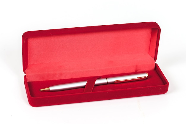 Silver pen in red box cover isolated.