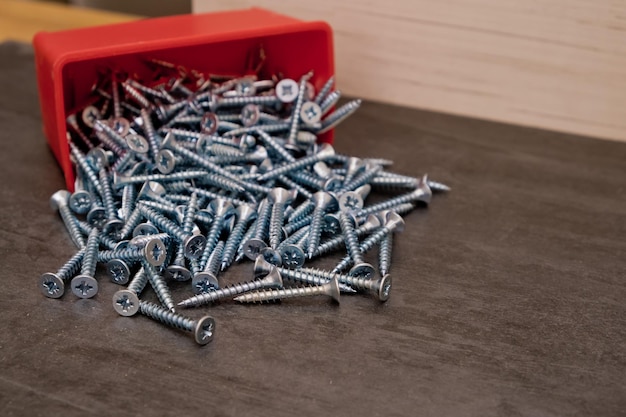 Silver self tapping screws a lot Texture background Selective focus