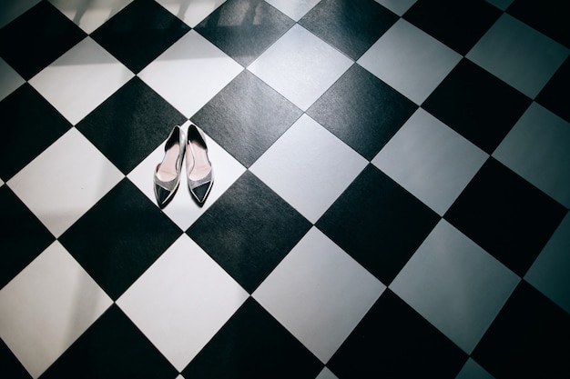 Silver wedding shoes on the floor