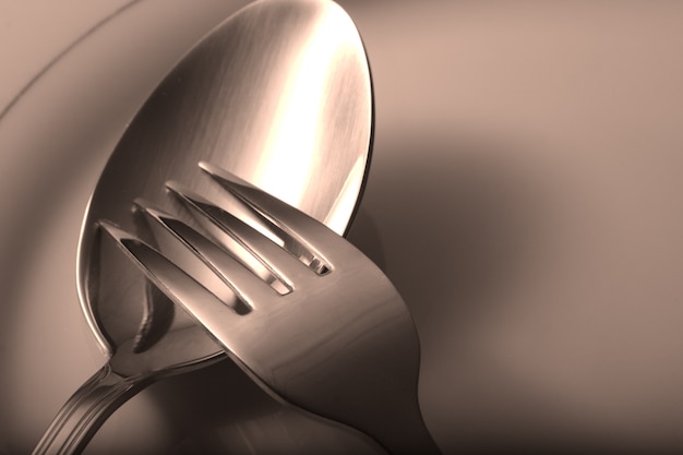 silverware fork,  spoon on white table