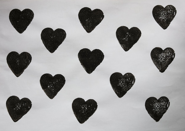 simple black hearts on white paper pattern