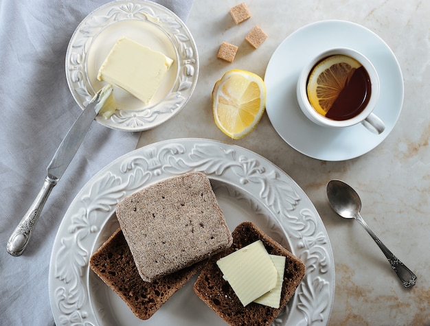 Simple Breakfast   lemon tea and rye bread with butter