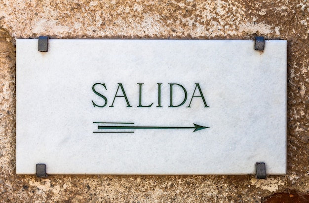 Simple marble cartel with the word Salida (Exit in Spanish)