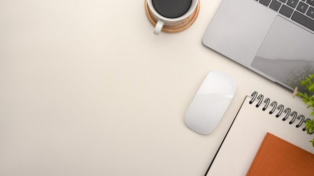 Simple office workspace with notebook laptop and copy space on white background top view