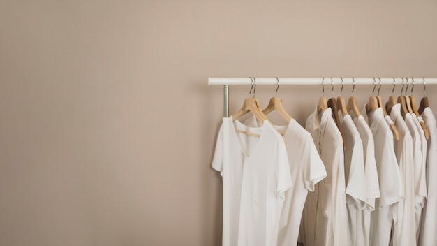 Simple wardrobe with white t-shirts copy space