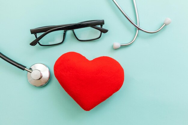 Simply minimal design medicine equipment stethoscope or phonendoscope glasses and red heart isolated