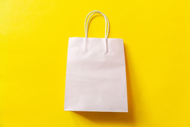 Simply minimal design shopping bag isolated on yellow