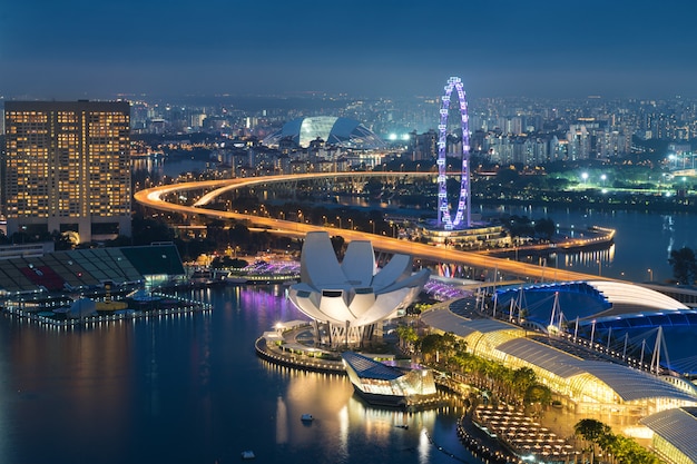 Singapore business district skyline in night at Marina Bay, Singapore.