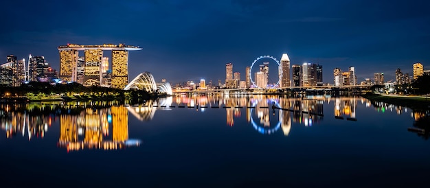 Singapore city skyline with modern skyscraper architecture building for concept of financial business and travel in Asia cityscape urban landmark marina bay at night district dusk sky