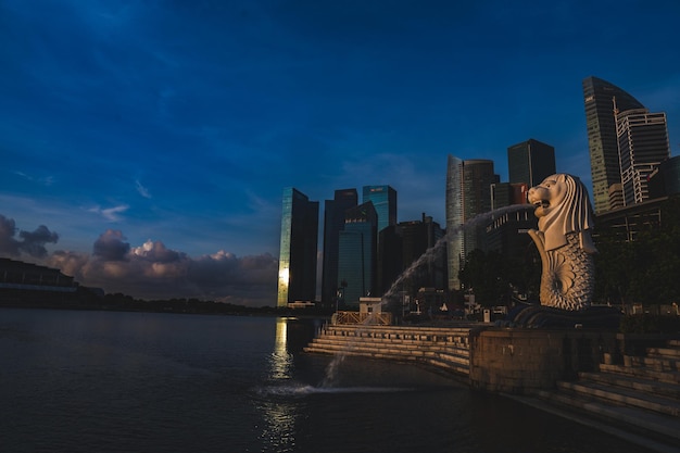 Singapore city skyline with modern skyscraper architecture building for concept of financial business and travel in Asia cityscape urban landmark marina bay at night district dusk sky