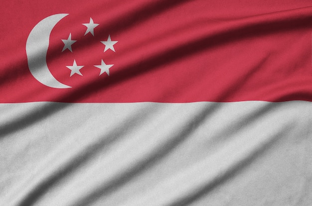 Singapore flag  is depicted on a cloth fabric with many folds