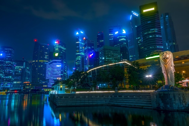 Singapore at night. Downtown with skyscrapers and Merlion