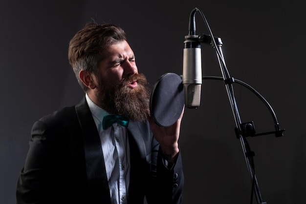 Singer man singing with a music microphone