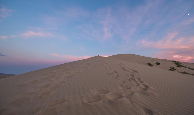 singing desert sand dune at sunsetKazakhstan