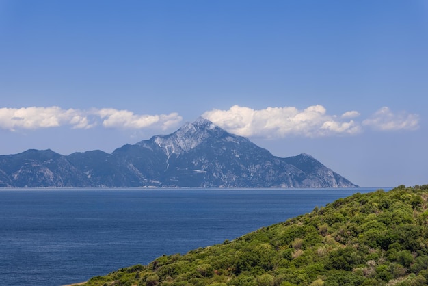 Singitic Gulf and opposite the world-famous historic Mount Athos with traditional snowwhite clouds