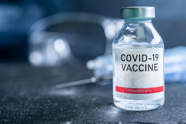 A single bottle vial of Covid19 vaccine Medical concept vaccination hypodermic injection treatment Vaccine and syringe injection