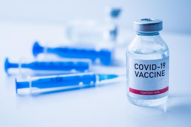 A single bottle vial of Covid19 vaccine Medical concept vaccination hypodermic injection treatment Vaccine and syringe injection