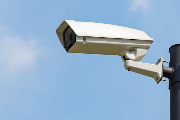 Single CCTV Security camera on clear sky background