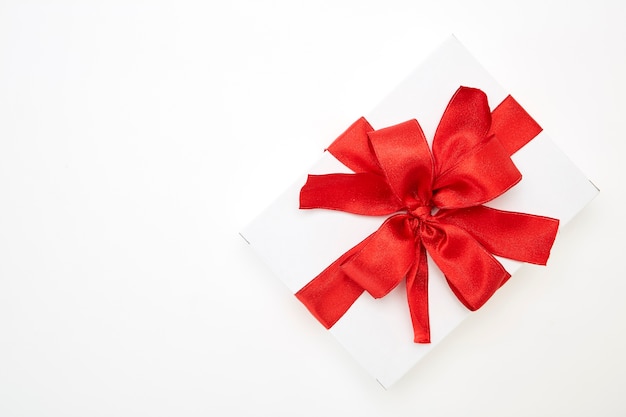 Single gift box with red ribbon