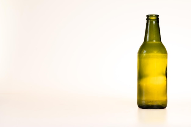 single green bottle on white background copy space