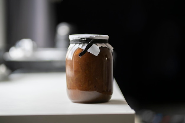 A single jar with jam at home on the shelf homemade food