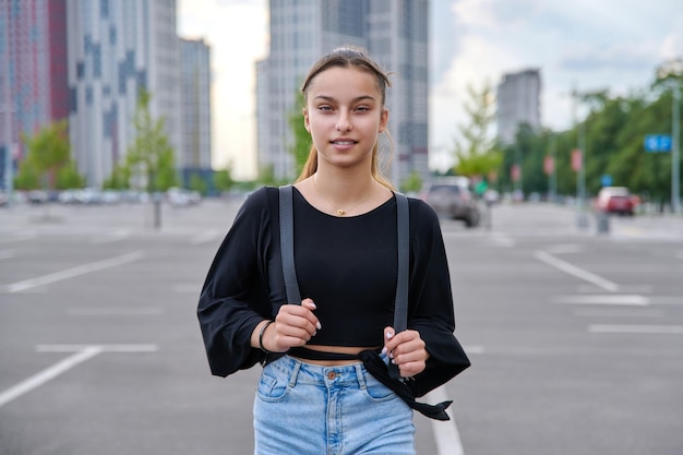 Single portrait of beautiful smiling fashionable teenage girl