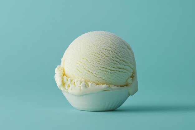 Photo a single scoop of creamy vanilla ice cream in a white bowl against a turquoise background