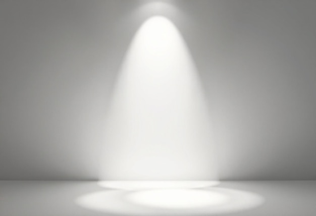 A single spotlight shines on a white background