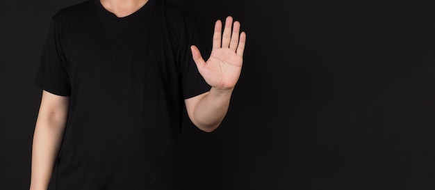 The single wave hand sign on black background